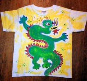 I recently painted this kids dragon shirt for a customer.